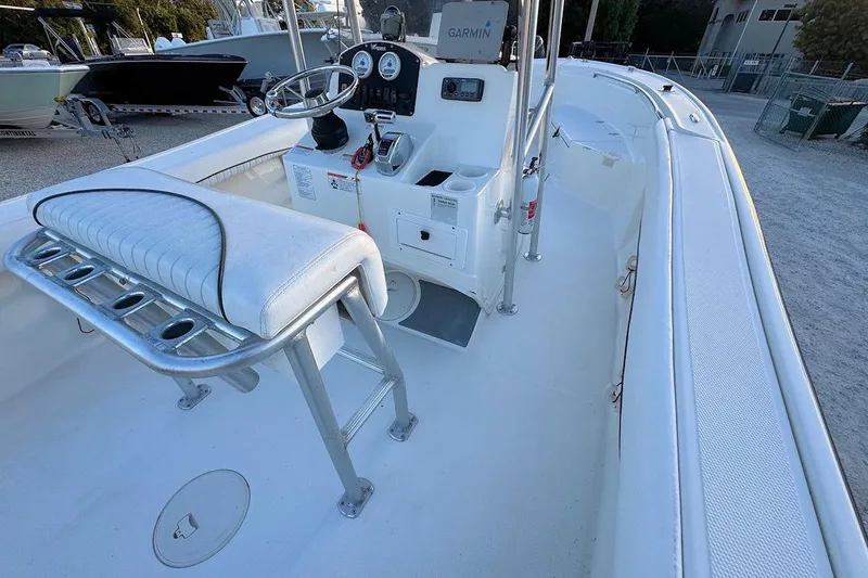 Slide: The Image of 2013 Mako 204 Center Console boat interior with steering wheel and seating. - 5