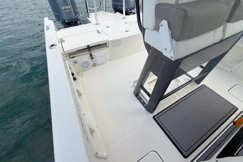 Slide: The Image of 2021 World Cat 235 CC boat interior with seating and Yamaha 150 engine. - 11