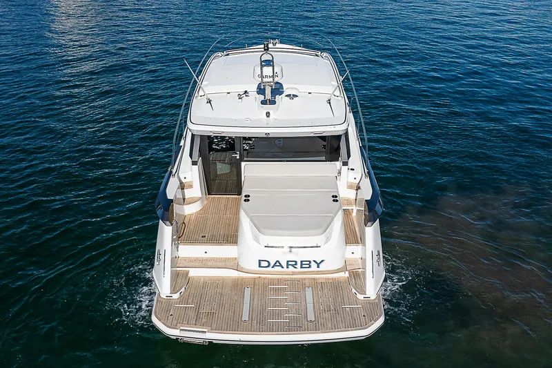 Slide: The Image of 2022 Beneteau Gran Turismo 45 yacht on water, rear view. - 19