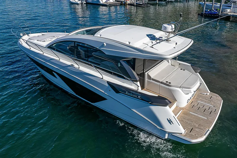 Slide: The Image of 2022 Beneteau Gran Turismo 45 luxury yacht on water. - 21