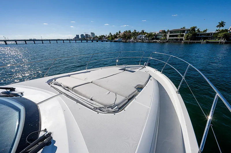 Slide: The Image of 2022 Beneteau Gran Turismo 45 yacht bow with sunpad, cruising on a sunny day. - 27