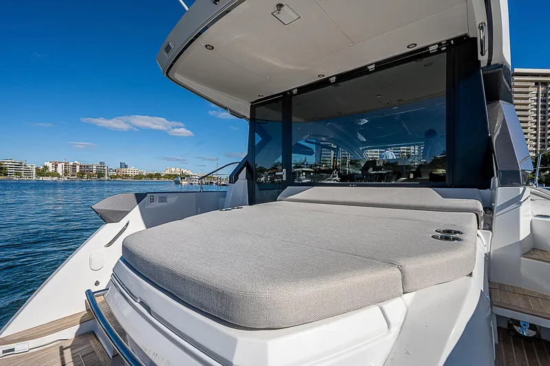 Slide: The Image of 2022 Beneteau Gran Turismo 45 yacht with spacious sun deck on a sunny day. - 35