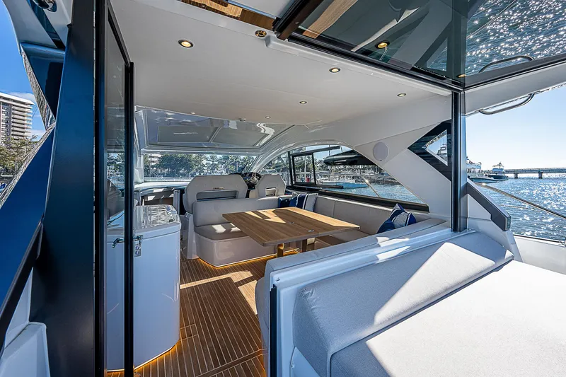 Slide: The Image of Interior of 2022 Beneteau Gran Turismo 45 yacht with modern seating and dining area. - 37