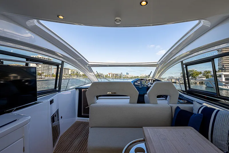 Slide: The Image of Interior of 2022 Beneteau Gran Turismo 45 yacht with modern seating and panoramic windows. - 41
