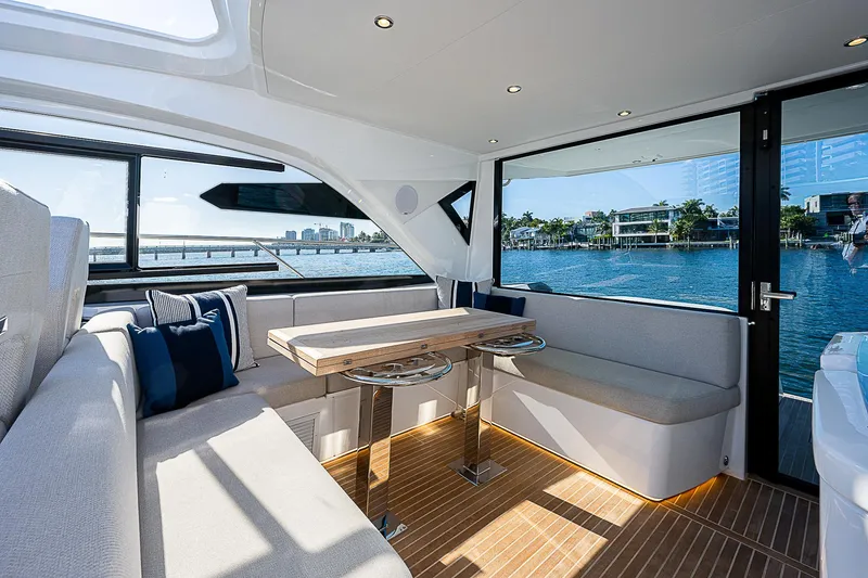Slide: The Image of Interior of 2022 Beneteau Gran Turismo 45 yacht with waterfront view. - 48