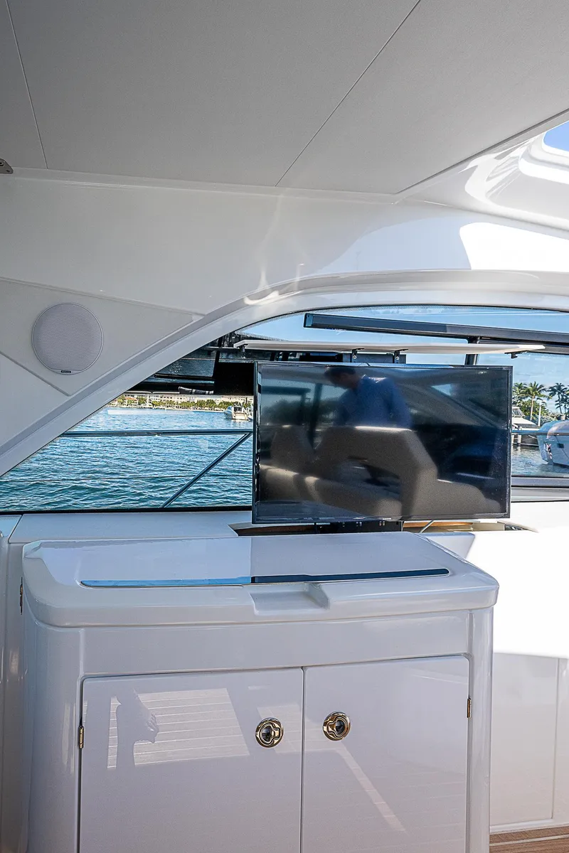 Slide: The Image of 2022 Beneteau Gran Turismo 45 yacht interior with TV and storage cabinet. - 49