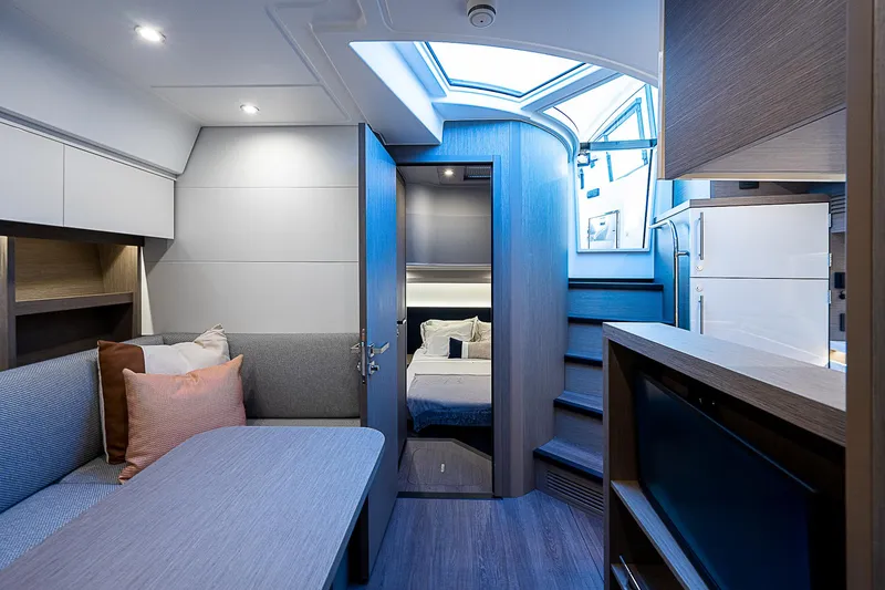 Slide: The Image of Interior of 2022 Beneteau Gran Turismo 45 yacht with modern furnishings and natural light. - 57