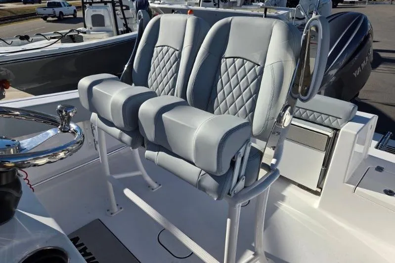 Slide: The Image of 2026 Sportsman Open 212 Center Console with dual cushioned seats and steering wheel. - 10