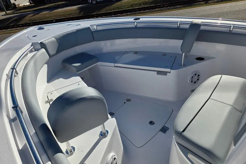Slide: The Image of 2026 Sportsman Open 212 Center Console boat interior with cushioned seating and storage. - 5