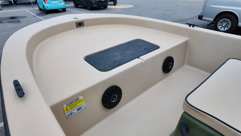 Slide: The Image of 2025 Carolina Skiff E18 JVX CC Swamp Edition boat interior with storage compartment. - 8
