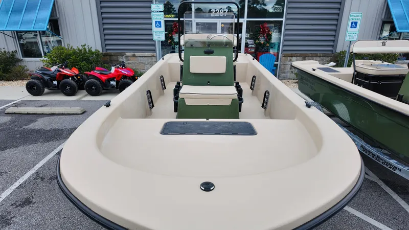Slide: The Image of 2025 Carolina Skiff E18 JVX CC Swamp Edition boat in parking lot. - 9