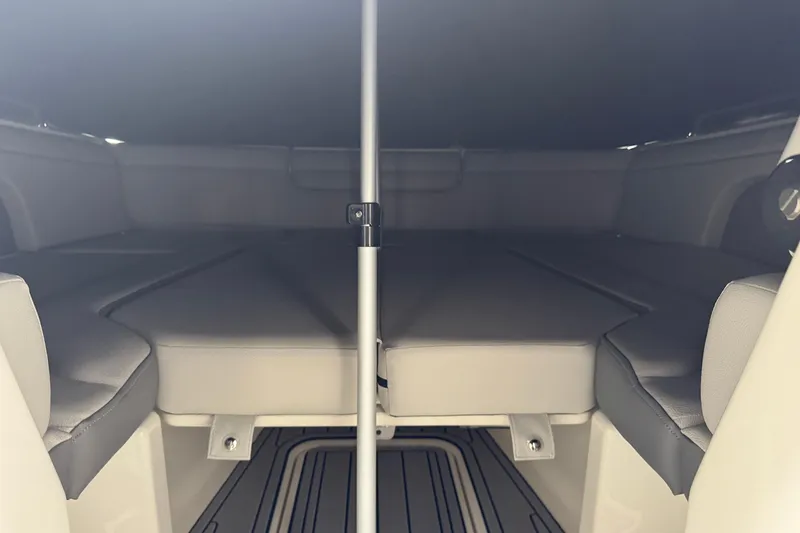 Slide: The Image of 2025 Sea Ray SDX 290 Outboard with twin V8 engines docked by a canal. - 10