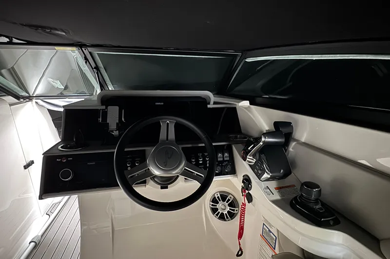 Slide: The Image of 2025 Sea Ray SDX 290 Outboard boat docked, featuring dual Mercury V8 engines. - 16