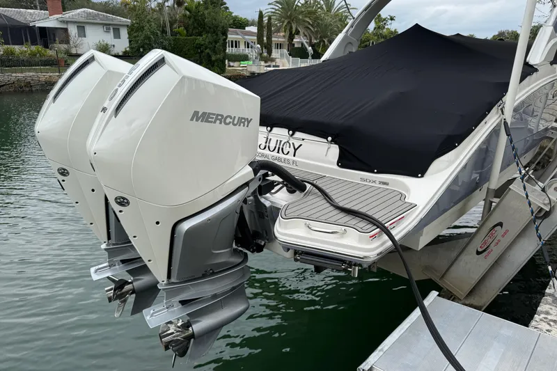 Slide: The Image of 2025 Sea Ray SDX 290 Outboard boat interior with modern helm and seating. - 19