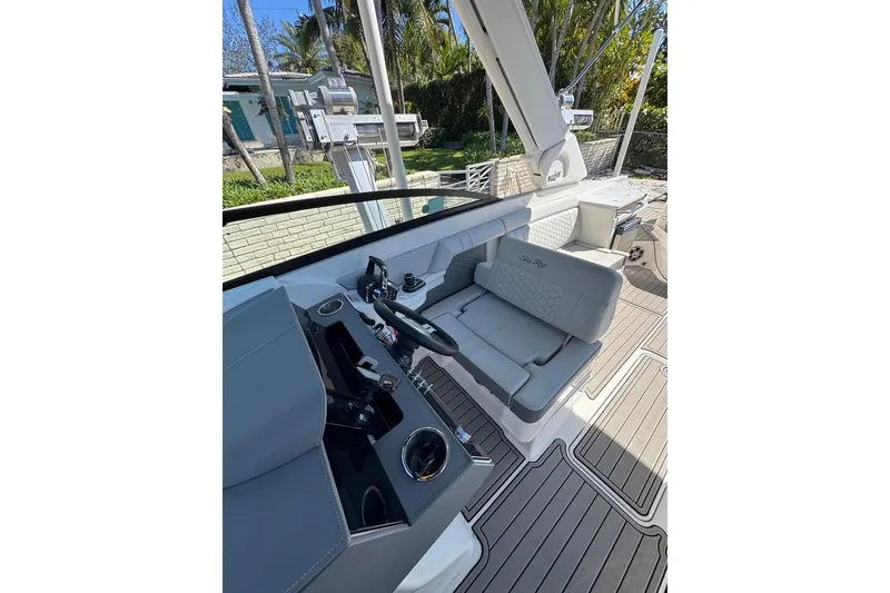 Slide: The Image of 2025 Sea Ray SDX 290 Outboard boat interior with sleek seating and modern controls. - 24