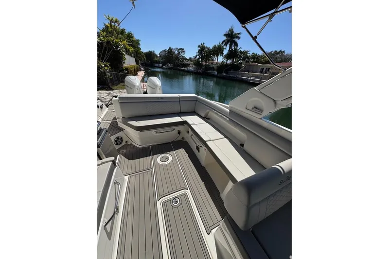 Slide: The Image of 2025 Sea Ray SDX 290 Outboard boat interior with spacious seating and elegant design. - 26