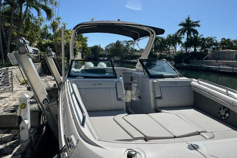 Slide: The Image of 2025 Sea Ray SDX 290 Outboard boat docked, featuring spacious seating and sleek design. - 37