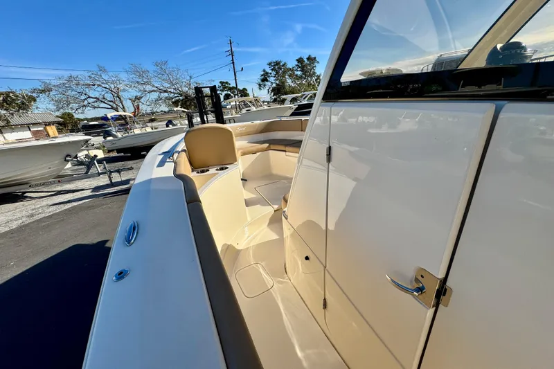 Slide: The Image of 2021 Scout 277 LXF boat with sleek design and spacious seating area. - 20