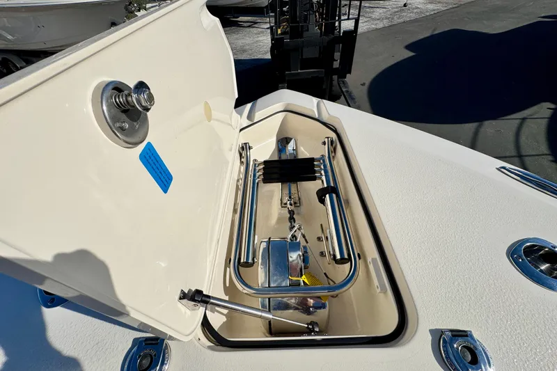Slide: The Image of 2021 Scout 277 LXF boat anchor compartment with stainless steel fittings. - 26