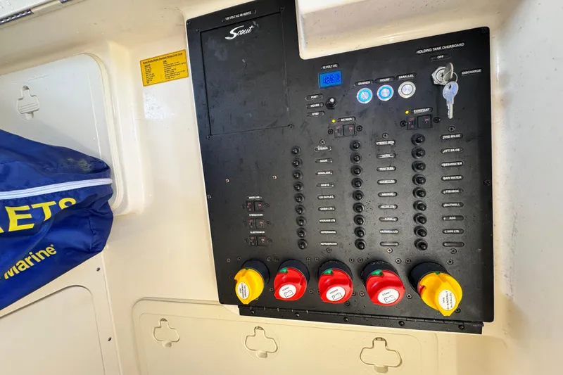 Slide: The Image of Control panel of a 2021 Scout 277 LXF boat with labeled switches and keys. - 31