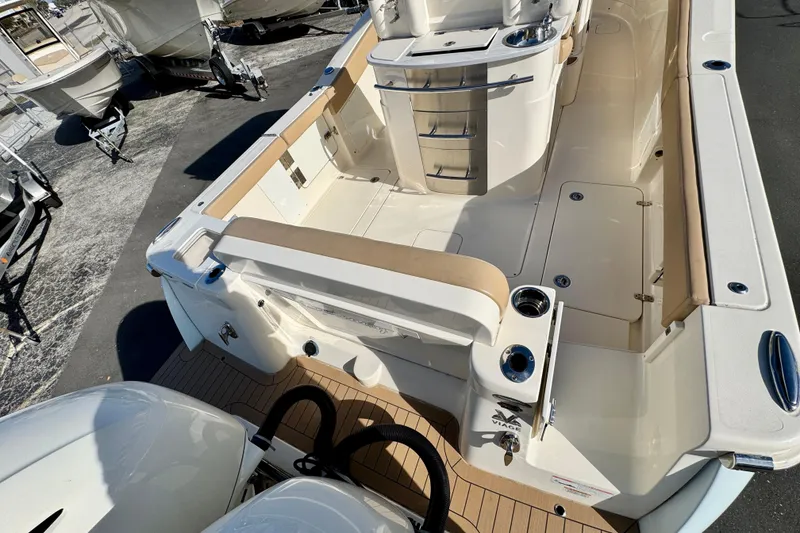 Slide: The Image of 2021 Scout 277 LXF boat interior with seating and storage compartments. - 8