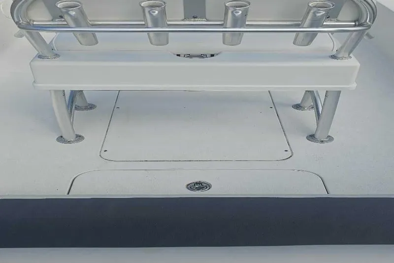 Slide: The Image of 2009 Ranger 2200 Bay Ranger boat deck with rod holders and storage compartments. - 3