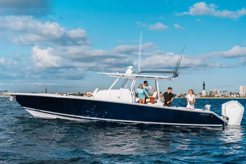 Slide: The Image of Manufacturer Provided Image: 2026 Jupiter 40 boat cruising on open water with people enjoying the ride. - 0