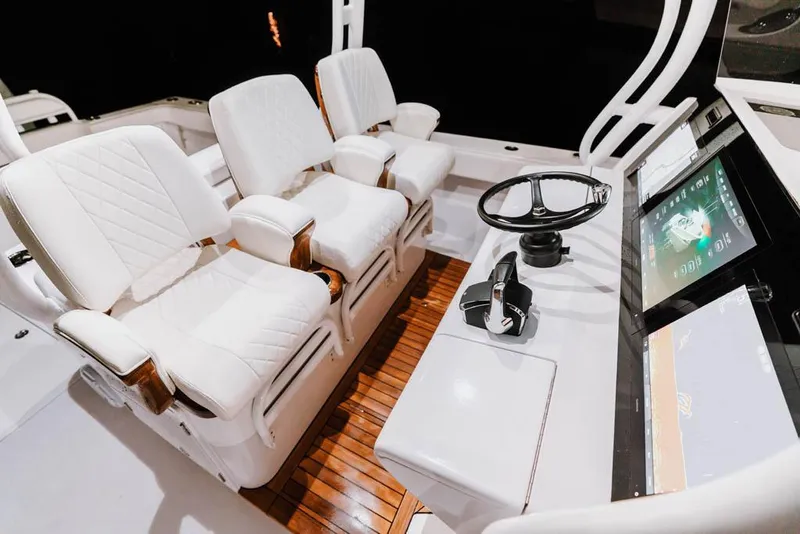 Slide: The Image of Manufacturer Provided Image: Luxurious 2026 Jupiter 40 boat interior with plush white seating and modern control panel. - 6