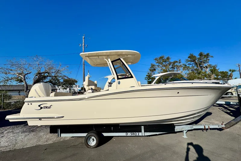 The Image of 2026 Scout 240 XSF boat on trailer under clear blue sky. - 0