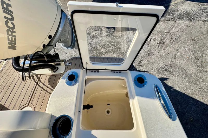 Slide: The Image of Open hatch on 2026 Scout 240 XSF boat with Mercury engine. - 10