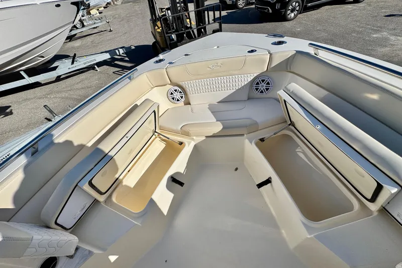 Slide: The Image of 2026 Scout 240 XSF boat interior with seating and storage compartments. - 19