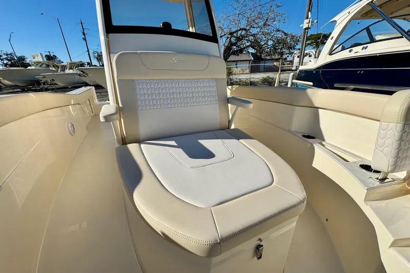 Slide: The Image of 2026 Scout 240 XSF boat interior with cushioned seating and modern design. - 21