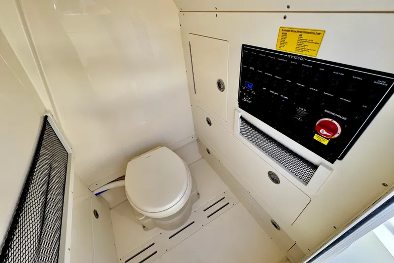 Slide: The Image of 2026 Scout 240 XSF boat interior with toilet and control panel. - 27