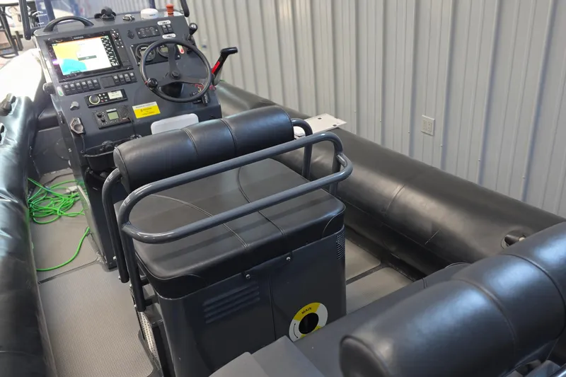 Slide: The Image of 2019 Sealegs 7.1 RIB interior with steering console and seating. - 13