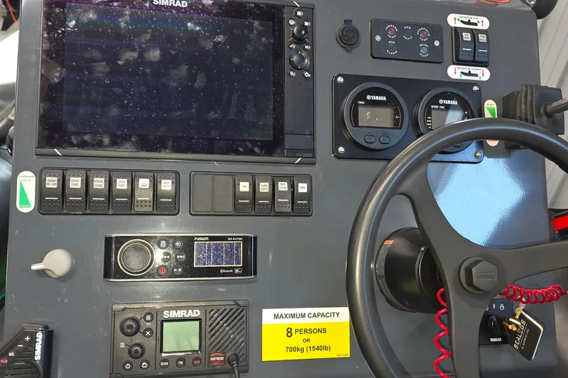 Slide: The Image of Control panel of a 2019 Sealegs 7.1 RIB with Simrad electronics and Yamaha gauges. - 17