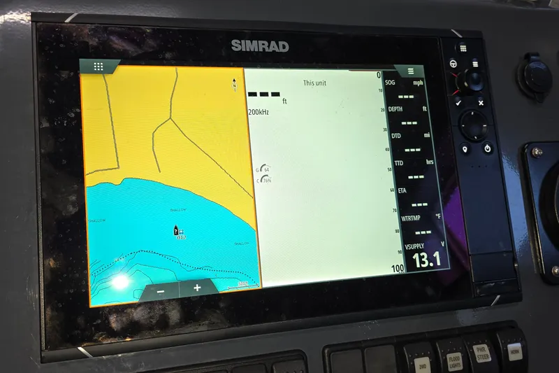 Slide: The Image of Simrad navigation display on 2019 Sealegs 7.1 RIB showing map and data. - 19