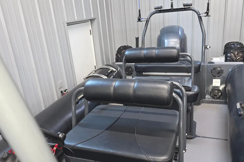 Slide: The Image of 2019 Sealegs 7.1 RIB interior with black seating and rugged design. - 22