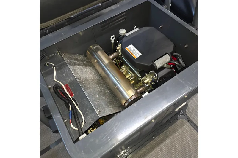 Slide: The Image of Engine compartment of 2019 Sealegs 7.1 RIB, showcasing mechanical components and wiring. - 24