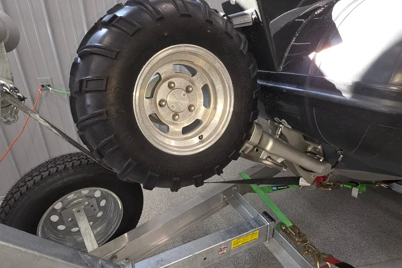 Slide: The Image of 2019 Sealegs 7.1 RIB with rugged wheel on trailer in garage. - 25