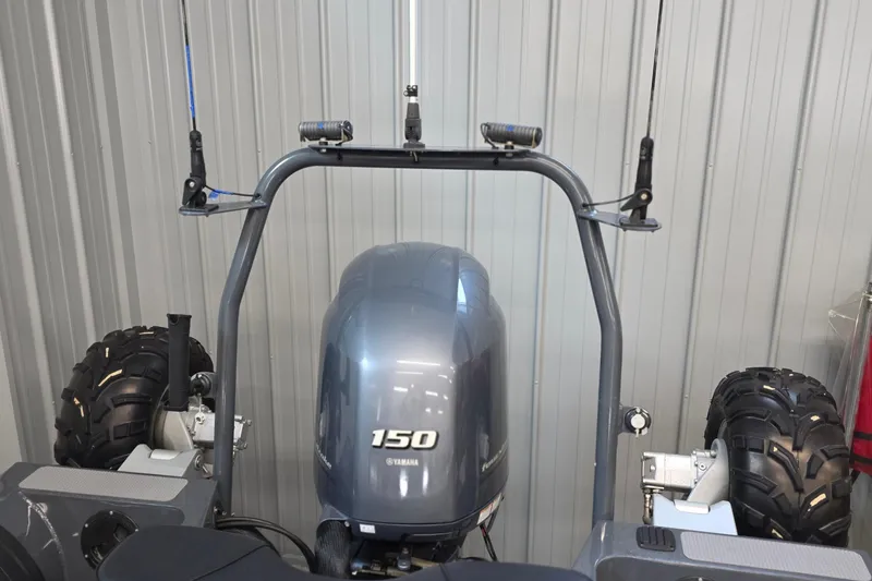 Slide: The Image of 2019 Sealegs 7.1 RIB with Yamaha 150 engine and rugged wheels in a garage. - 28