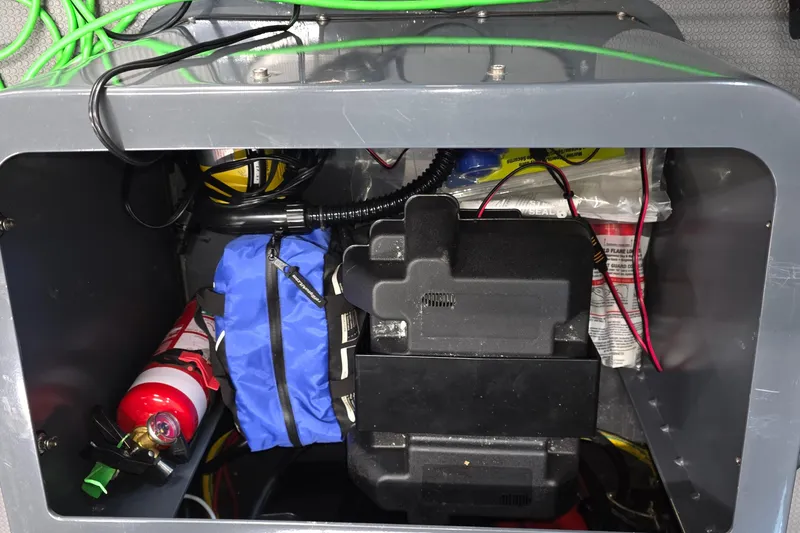 Slide: The Image of Interior storage of 2019 Sealegs 7.1 RIB with safety equipment and wiring. - 30