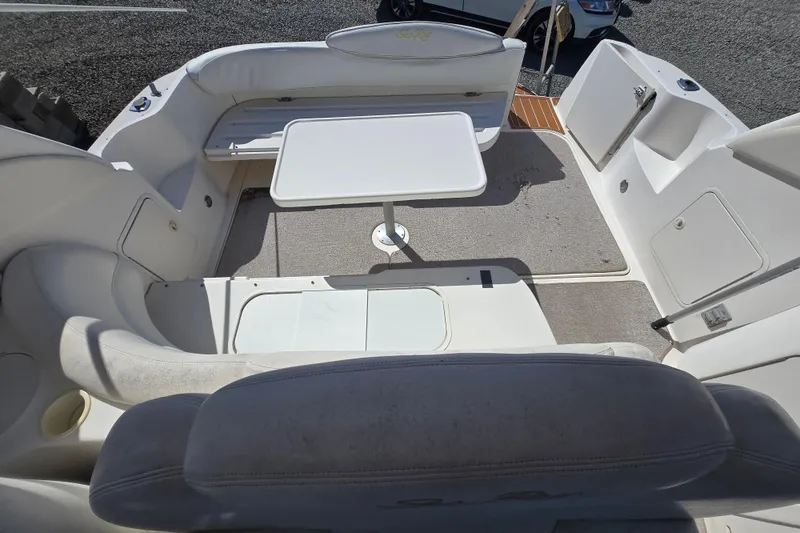 Slide: The Image of 1999 Sea Ray 340 Sundancer boat interior with seating and table. - 27