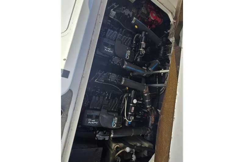 Slide: The Image of Engine compartment of a 1999 Sea Ray 340 Sundancer with twin 7.4 MPI engines. - 28