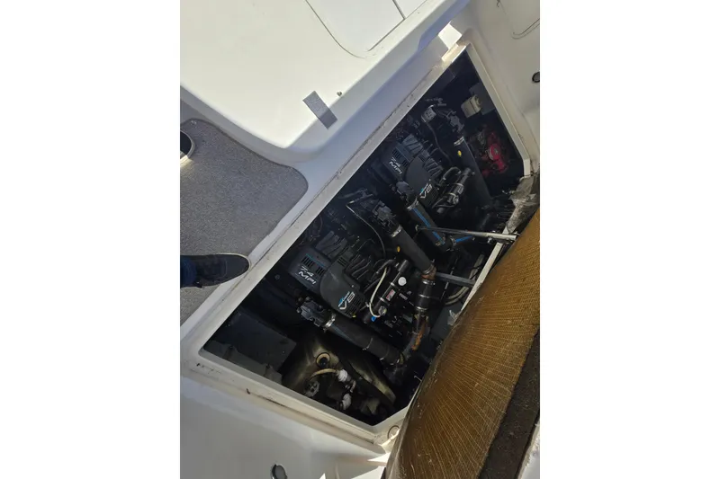 Slide: The Image of Engine compartment of a 1999 Sea Ray 340 Sundancer boat, showing mechanical components. - 6
