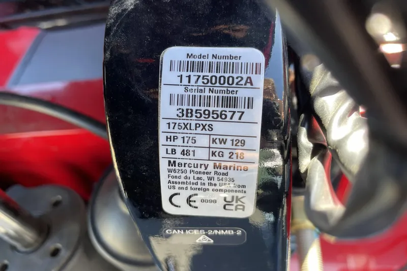 Slide: The Image of Label on a 2026 Tracker Targa V-18 WT boat engine, showing model and serial numbers. - 114