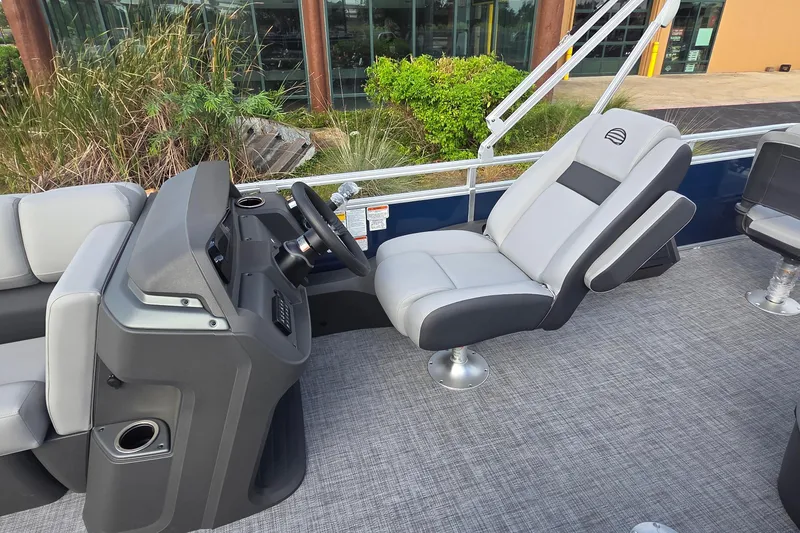 Slide: The Image of 2026 Sun Tracker SportFish 22 DLX boat interior with modern helm and comfortable seating. - 9
