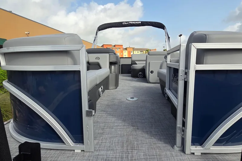 Slide: The Image of 2026 Sun Tracker SportFish 22 DLX pontoon boat with spacious seating and modern design. - 4