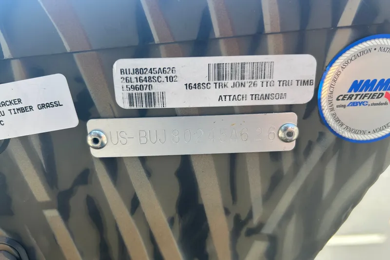 Slide: The Image of 2026 Tracker Grizzly 1648 SC boat identification tags and certification label. - 38