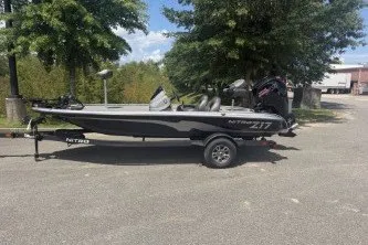 The Image of 2026 Nitro Z17 boat on trailer, parked outdoors near trees. - 0