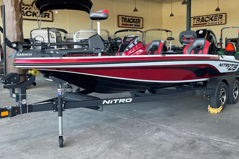 The Image of 2026 Nitro Z19 XL Pro boat in showroom, featuring sleek design and Garmin equipment. - 0